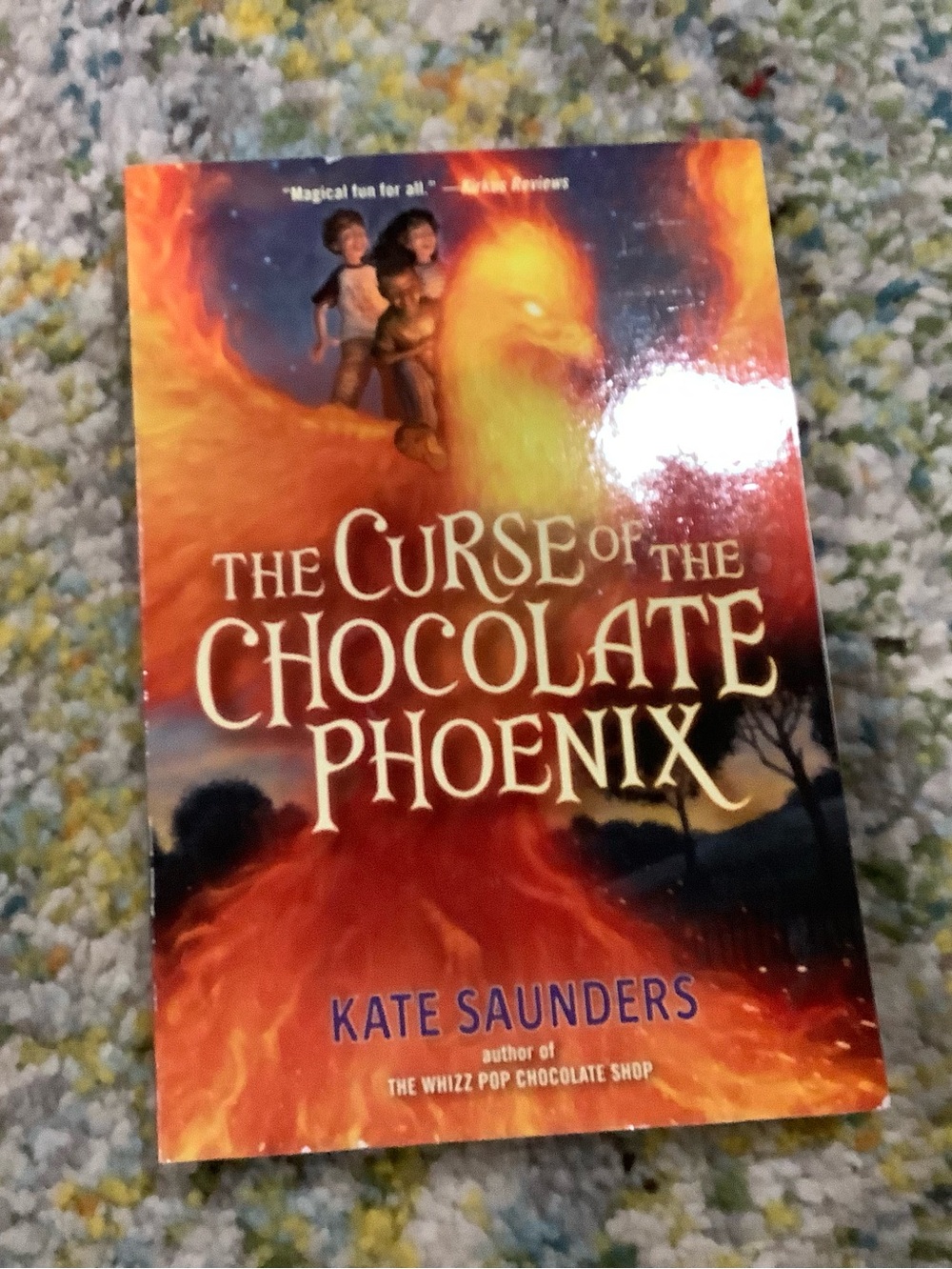 The Curse of the Chocolate Phoenix by Kate Saunders - Fiery Orange Cover